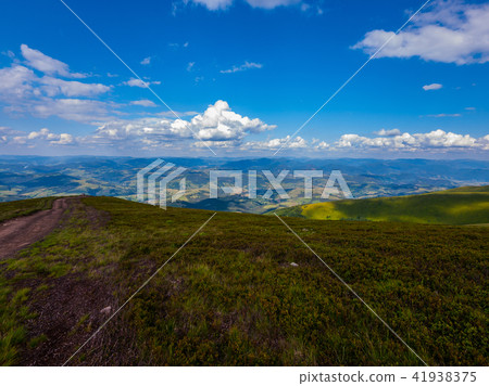 a view of the distant mountains from the top of th a view of the distant mountains from the top of th 41938375
