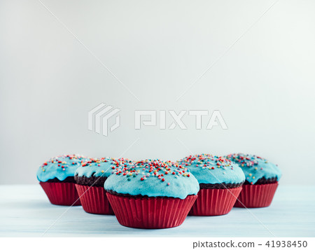 Festive cupcakes with turquoise glaze Festive cupcakes with turquoise glaze 41938450