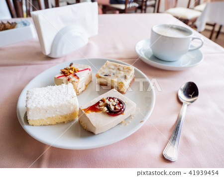 Breakfast in cafe - cappuccino and desserts Breakfast in cafe - cappuccino and desserts 41939454