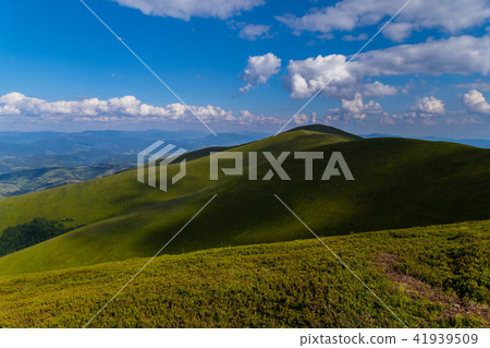 A deep blue sky with white clouds lying over mount A deep blue sky with white clouds lying over mount 41939509