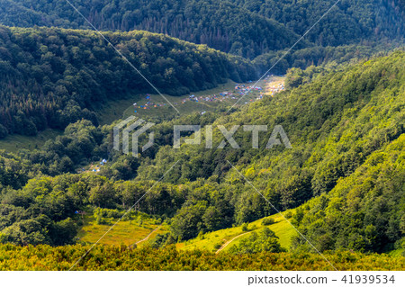 A tent camp lurking in the midst of green forests 41939534
