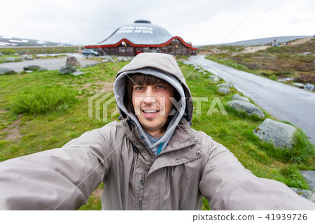 Tourist making selfie on Arctic circle. Norway Tourist making selfie on Arctic circle. Norway 41939726