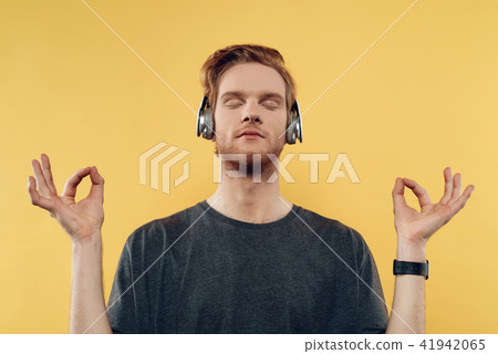 Young Man Listening to Music With Headphones Young Man Listening to Music With Headphones 41942065