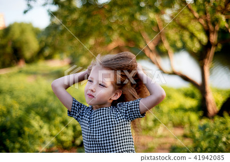 Baby 4 years, with blue eyes, small curls. A wonderful time of childhood and adventure.Warm sunlight 41942085