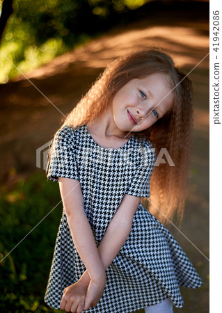 Baby 4 years, with blue eyes, small curls. A wonderful time of childhood and adventure.Warm sunlight 41942086