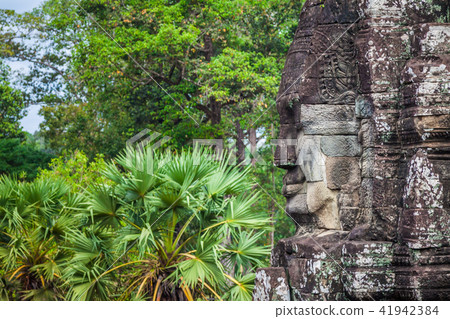 Ancient stone faces of Bayon temple, Angkor Ancient stone faces of Bayon temple, Angkor 41942384