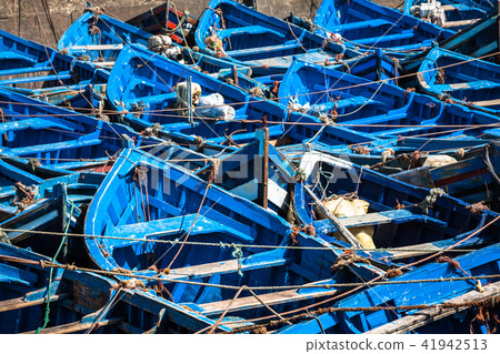 Lots of blue fishing boats in the port Lots of blue fishing boats in the port 41942513
