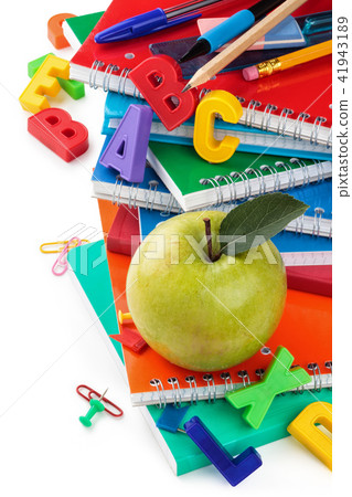 Notebooks and green apple. Notebooks and green apple. 41943189
