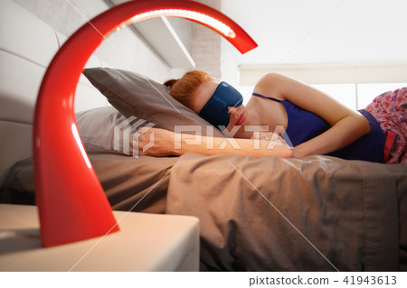 Woman In Bed Sleeping With Sleep Mask On Eyes 41943613
