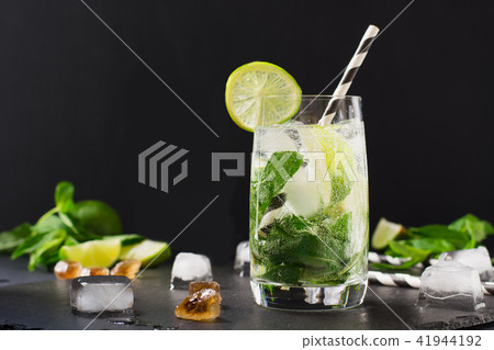 One shot of mojito cocktail in glass on black. One shot of mojito cocktail in glass on black. 41944192