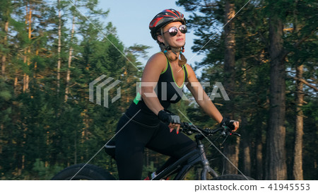 Fat bike also called fatbike or fat-tire bike in summer riding in the forest. Fat bike also called fatbike or fat-tire bike in summer riding in the forest. 41945553
