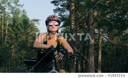 Fat bike also called fatbike or fat-tire bike in summer riding in the forest. Fat bike also called fatbike or fat-tire bike in summer riding in the forest. 41945554