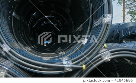 Warehouse of finished plastic pipes industrial outdoors storage site. Manufacture of plastic water 41945696