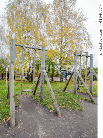 Children rope swing in the autumn park Children rope swing in the autumn park 41946577