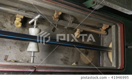 Pipes manufacturing production line. Manufacture of plastic water pipes factory. Process of making Pipes manufacturing production line. Manufacture of plastic water pipes factory. Process of making 41946995