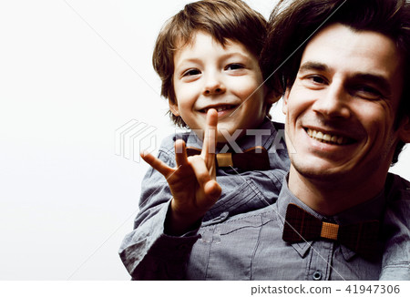 father with son in bowties on white background, casual look fami father with son in bowties on white background, casual look fami 41947306