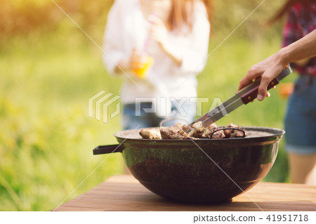 Grill standing on picnic table outdoors. Grill standing on picnic table outdoors. 41951718