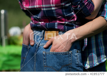 Guy holding his girlfriends butt. 41951777
