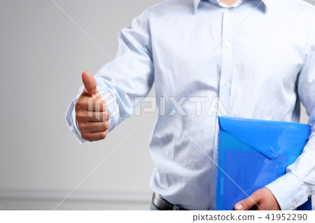 Handsome young businessman showing ok 41952290