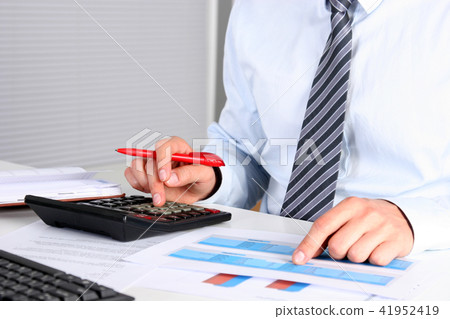 businessman sitting at the table with laptop. 41952419