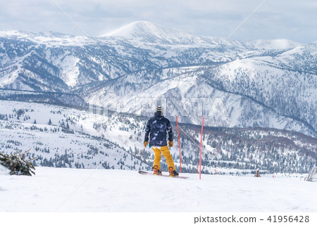Skiers and snowboarder prepare to start Skiers and snowboarder prepare to start 41956428