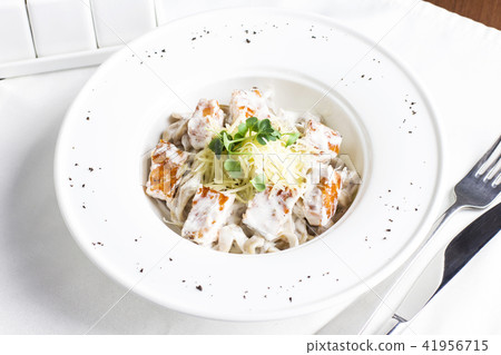 Pasta spaghetti with salmon, cheese and herbs  41956715