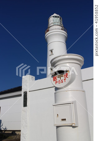White post in front of lighthouse White post in front of lighthouse 41958852