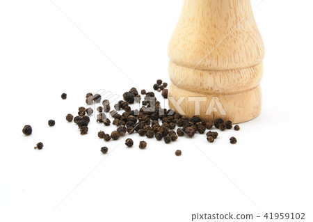 pepper mill of wood with peppercorns pepper mill of wood with peppercorns 41959102