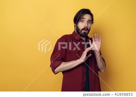 Portrait of Indignation Man Looking at Camera 41959853