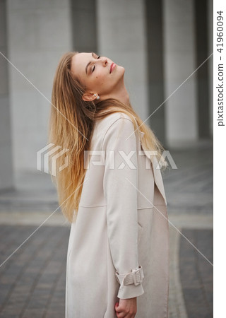 beautiful blonde girl in the street 41960094