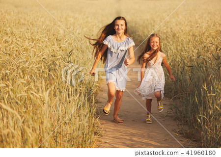 young girl in the yellow field young girl in the yellow field 41960180