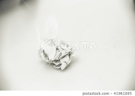 Crumpled paper on white table background Crumpled paper on white table background 41961895