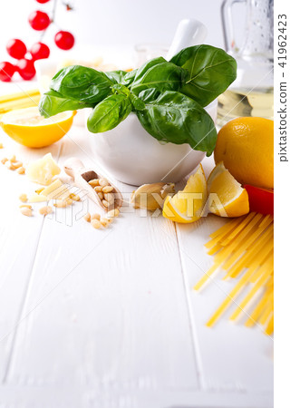 Food ingredients for italian pasta, spaghetti on white wooden background. Copy space of your text. Food ingredients for italian pasta, spaghetti on white wooden background. Copy space of your text. 41962423