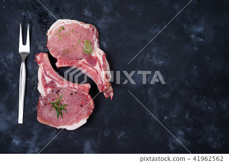 Raw Lamb Ribs on rustic black background. Top View 41962562