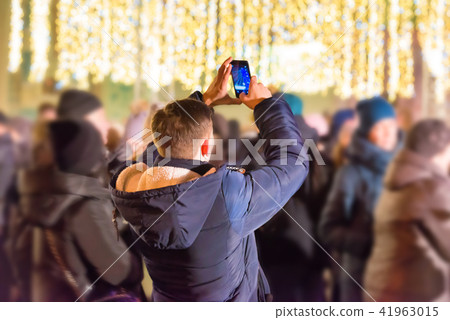 A man with smartphone on city street 41963015