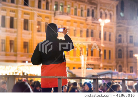 A man with smartphone on city street 41963016