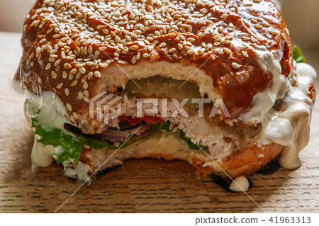 Cheeseburger on wooden board Cheeseburger on wooden board 41963313