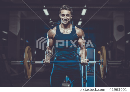 Handsome model young man workout in gym 41963901