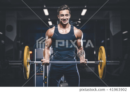 Handsome model young man workout in gym 41963902