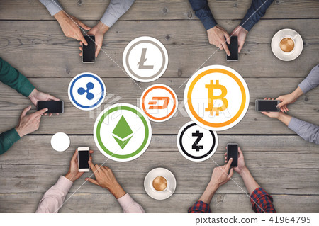 Teamwork concept. Six creative people working cryptocurrency Icon Concept Top view on wooden Teamwork concept. Six creative people working cryptocurrency Icon Concept Top view on wooden 41964795