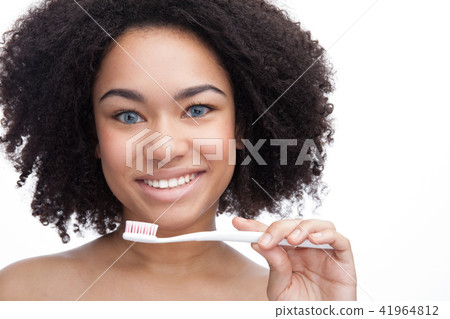 Beautiful young african teenage smile with brushing teeth . Dental health background. Beautiful young african teenage smile with brushing teeth . Dental health background. 41964812