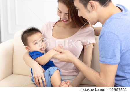 Portrait of young happy family with baby Portrait of young happy family with baby 41965831