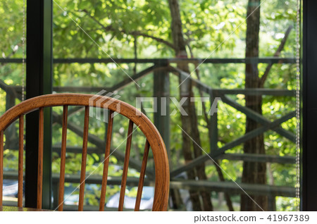 Wooden chair and green landscape 41967389