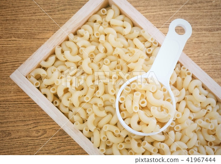 Elbow Macaroni or Gomiti Pasta in Measuring Cup Elbow Macaroni or Gomiti Pasta in Measuring Cup 41967444