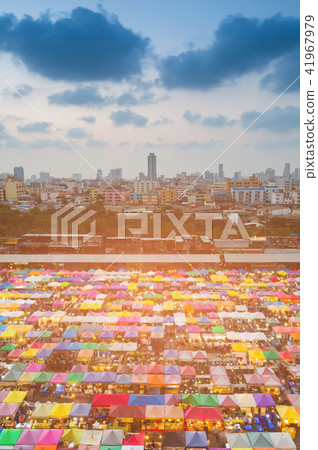 Aerial view multiple colour flea market roof top 41967979