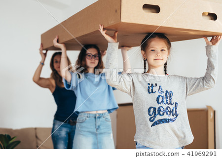 Family with cardboard boxes. Moving into new home Family with cardboard boxes. Moving into new home 41969291