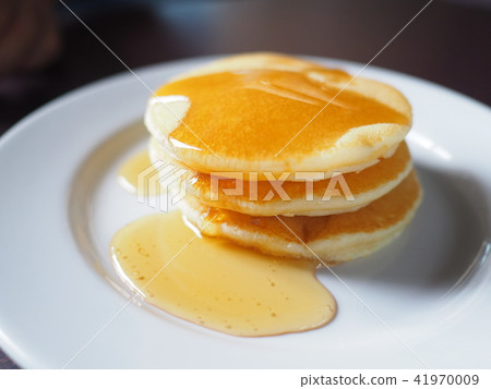 Stack of pancakes dessert with maple syrup. Stack of pancakes dessert with maple syrup. 41970009