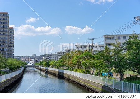 Landscape of a condominium along a river 41970334