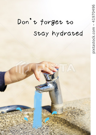 Children's hand pressing a fountain and faucet in the park Do not forget to stay hydrated. 41970496