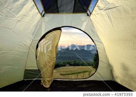 View from inside a tent on mountains landscape View from inside a tent on mountains landscape 41973393